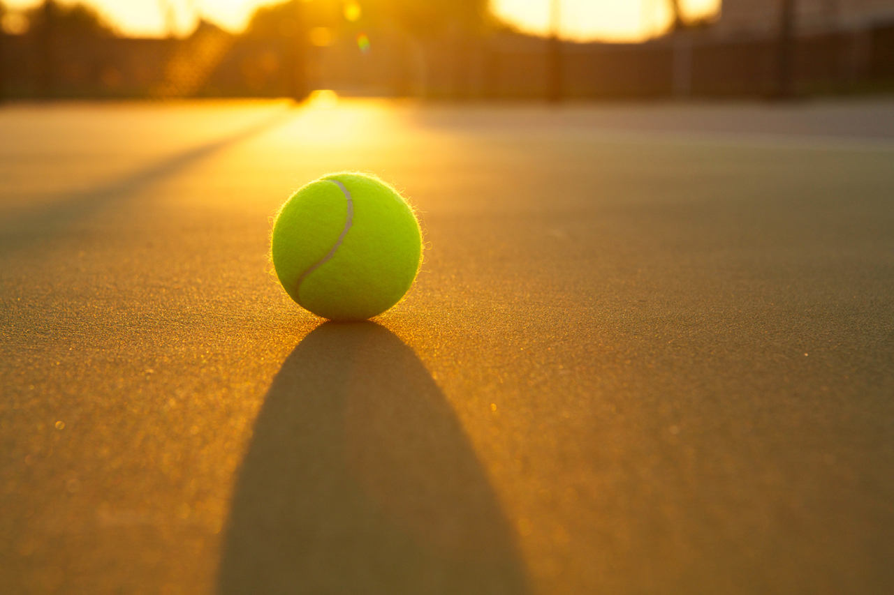 Tennis Ball Backlit by a Warm Sun